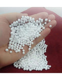 Polystyrene beans in human hand